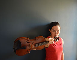 photo of Bernadette Kellermann holding a violin