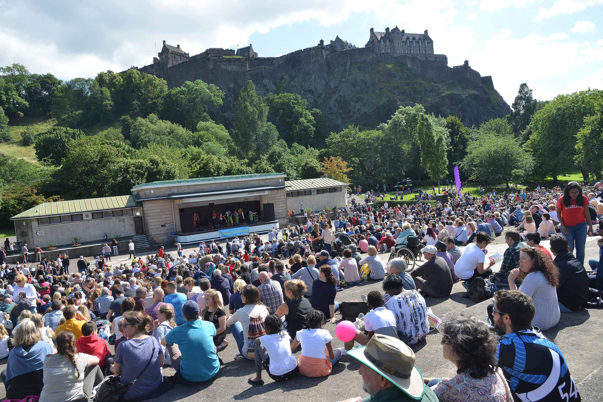 audience looking at performance in Princes Street Gardens